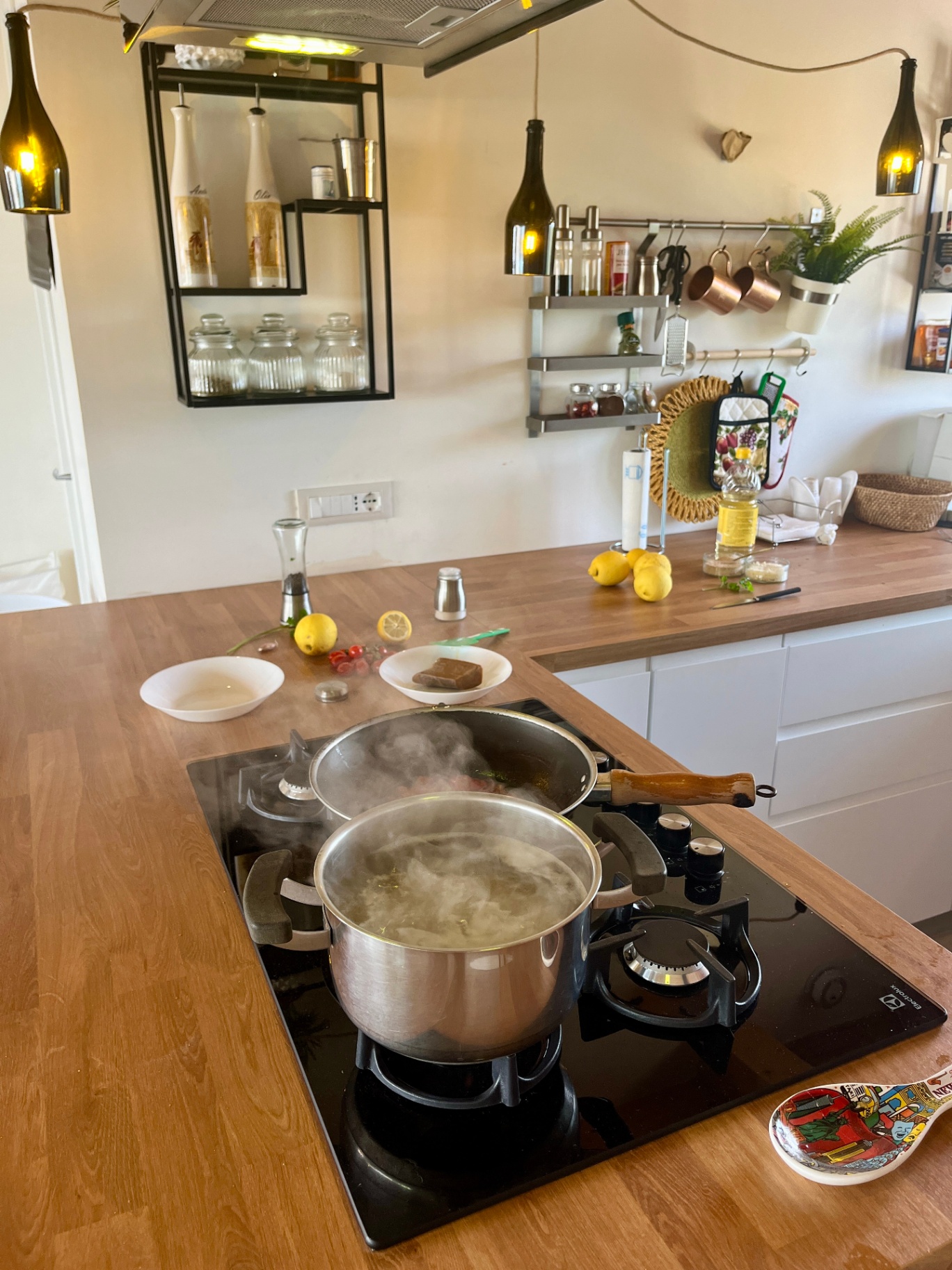 Open kitchen and living space at The Blue Window sea-view apartment, South-East Sicily
